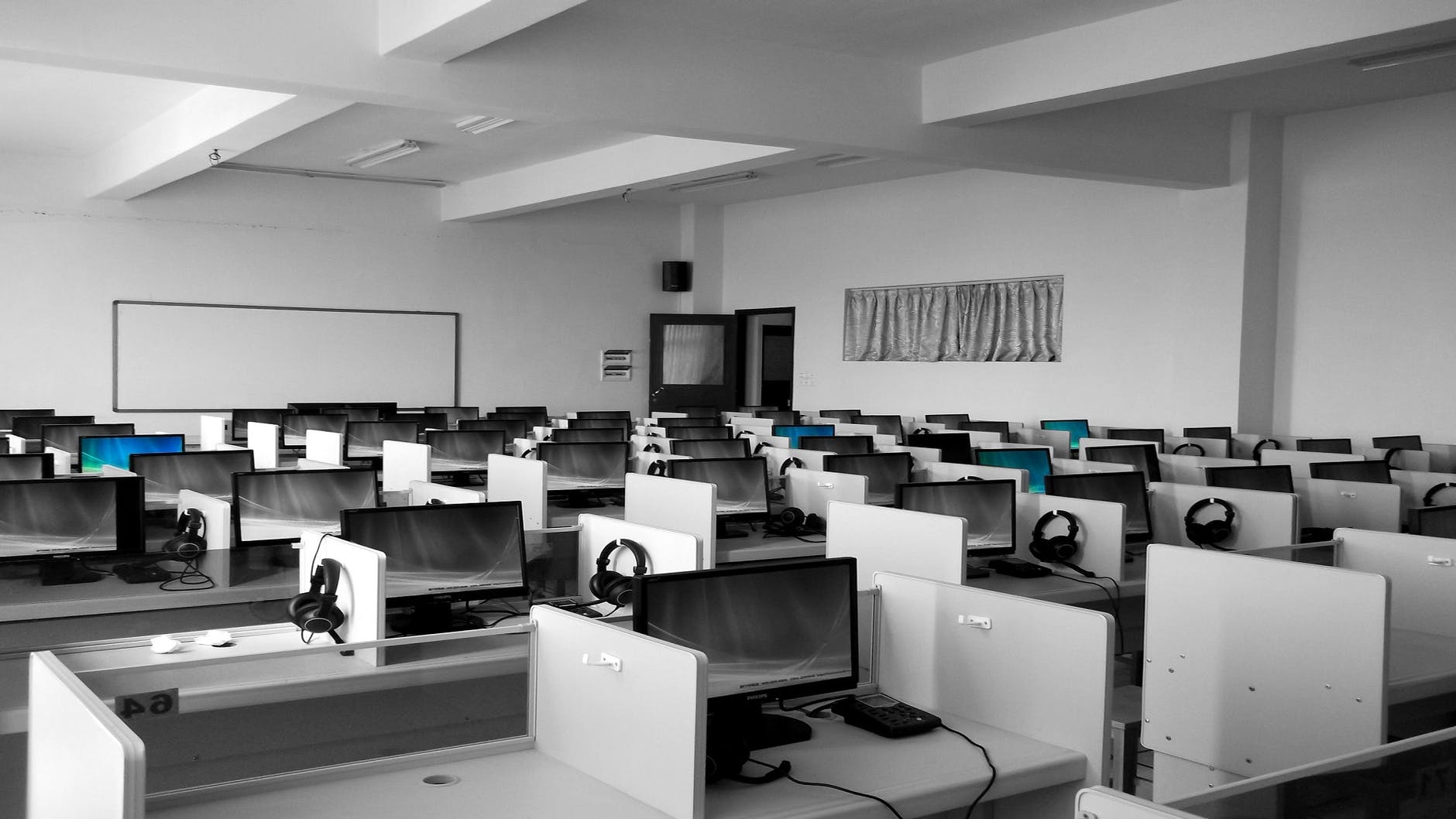 gray wooden computer cubicles inside room